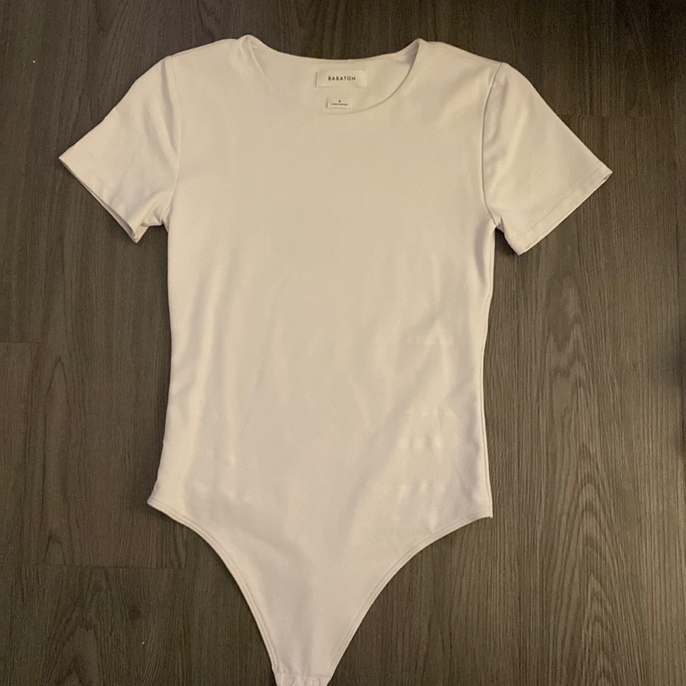 Babaton one piece slim fit white but with slight pinkish tint